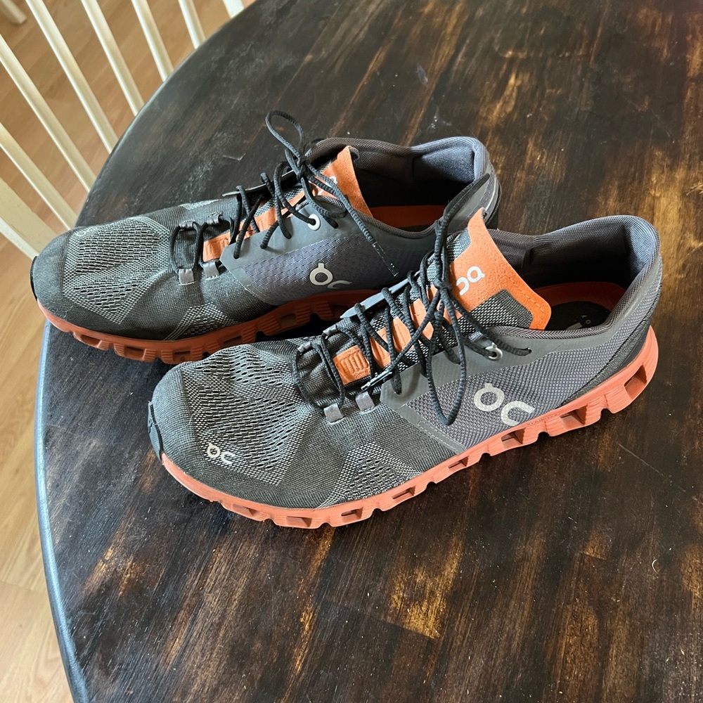 On. Cloud Running Shoes A dark gray and red- orange